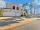 Traditional two-story home boasting a three-car garage, mature landscaping, and a spacious driveway at 19531 N 69Th Ave, Glendale, AZ 85308