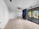 Large living room with tile floors, a fireplace, and sliding glass doors to the backyard at 19531 N 69Th Ave, Glendale, AZ 85308