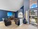 Inviting living room with a large television, wood floors, and a modern interior design at 19531 N 69Th Ave, Glendale, AZ 85308