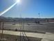 View of a residential street with new construction homes and desert landscape at 20863 N 223Rd Ave, Surprise, AZ 85387