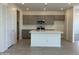 Modern kitchen with gray cabinets, white countertops, and an island at 20863 N 223Rd Ave, Surprise, AZ 85387