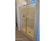 Modern shower with glass enclosure and built-in shelf at 20863 N 223Rd Ave, Surprise, AZ 85387