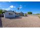 Sun-drenched backyard with gravel and a covered patio at 2112 E Fremont E Dr, Tempe, AZ 85282