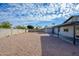 Landscaped backyard with gravel and a covered patio at 2112 E Fremont E Dr, Tempe, AZ 85282