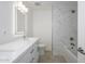 Bright bathroom with a bathtub, marble shower, and vanity at 2112 E Fremont E Dr, Tempe, AZ 85282