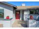 Modern red front door flanked by brick columns and planters at 2112 E Fremont E Dr, Tempe, AZ 85282