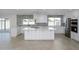 Updated kitchen featuring white cabinets, stainless steel appliances, and island at 2112 E Fremont E Dr, Tempe, AZ 85282