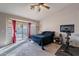 Main bedroom with sliding glass door to backyard and exercise bike at 2217 E Devon Ct, Gilbert, AZ 85296