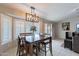 Dining area with wood table and chairs, and view of the backyard at 2217 E Devon Ct, Gilbert, AZ 85296