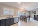 Kitchen with dark gray cabinets, quartz countertops, and stainless steel appliances at 2217 E Devon Ct, Gilbert, AZ 85296