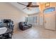 Bright living room with tile floors and plantation shutters at 2217 E Devon Ct, Gilbert, AZ 85296