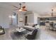 Bright living room featuring contemporary decor, ceiling fan, and an open layout, creating a welcoming space at 2217 E Devon Ct, Gilbert, AZ 85296