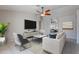 Stylish living room with a ceiling fan, neutral tones, modern furniture, and lots of space at 2217 E Devon Ct, Gilbert, AZ 85296