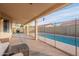 Relaxing covered patio overlooking a sparkling pool at 2217 E Devon Ct, Gilbert, AZ 85296