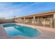 Inviting kidney-shaped pool with safety fence at 2217 E Devon Ct, Gilbert, AZ 85296