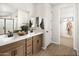 Double vanity bathroom with walk-in shower and closet at 22645 W Irma Ln, Surprise, AZ 85387