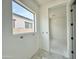 Bright bathroom features a large window offering natural light and modern design elements at 22708 E Lords Way, Queen Creek, AZ 85142