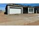 Angle shot of a single-story home featuring stucco walls, a two-car garage, and a neatly landscaped yard at 22708 E Lords Way, Queen Creek, AZ 85142