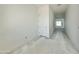 Bright hallway with neutral walls, leading towards the living spaces at 22708 E Lords Way, Queen Creek, AZ 85142