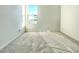 Simple bedroom with gray carpet, a window, and white walls at 22717 E Saddle Way, Queen Creek, AZ 85142