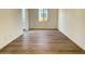 Light-filled dining room with wood-look tile floors at 22717 E Saddle Way, Queen Creek, AZ 85142