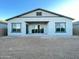 Home's back exterior features a covered patio at 22717 E Saddle Way, Queen Creek, AZ 85142