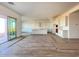 Open concept kitchen with island and white cabinets at 22717 E Saddle Way, Queen Creek, AZ 85142