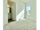 Bedroom with neutral carpet, a large window, and an adjoining bathroom at 22740 E Lords Way, Queen Creek, AZ 85142