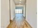 Hallway featuring recessed lighting and wood-look floors leading to the sliding doors that lead to backyard at 22740 E Lords Way, Queen Creek, AZ 85142