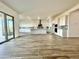 Open concept living space with tile floors connects the kitchen and living areas at 22740 E Lords Way, Queen Creek, AZ 85142