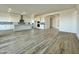 Open concept living space with tile floors connects the kitchen and living areas at 22740 E Lords Way, Queen Creek, AZ 85142