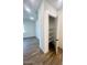 A hallway with a pantry and wood-look tile floor at 22910 E Alyssa Rd, Queen Creek, AZ 85142