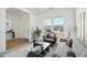 Bright and airy living room with a comfy sitting area at 22910 E Alyssa Rd, Queen Creek, AZ 85142