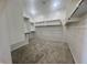 Large walk-in closet with ample shelving and hanging space at 22910 E Alyssa Rd, Queen Creek, AZ 85142