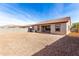 Backyard view of house and gravel area at 2355 N Oakmont Ln, Casa Grande, AZ 85122