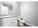 Bathroom with white vanity, granite countertop, and toilet at 2355 N Oakmont Ln, Casa Grande, AZ 85122