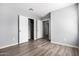 Bedroom with wood-look floors and double door closet at 2355 N Oakmont Ln, Casa Grande, AZ 85122