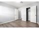 Bright bedroom with wood-look floors and spacious closet at 2355 N Oakmont Ln, Casa Grande, AZ 85122