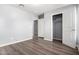 Spacious bedroom featuring wood-look floors and a large closet at 2355 N Oakmont Ln, Casa Grande, AZ 85122