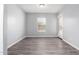 Bright dining room with wood-look floors and door to backyard at 2355 N Oakmont Ln, Casa Grande, AZ 85122