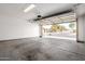 Garage with open door, showing residential street view at 2355 N Oakmont Ln, Casa Grande, AZ 85122