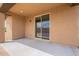 Covered back porch has a sliding door and space for outdoor seating at 24153 W Hilton Ave, Buckeye, AZ 85326