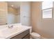 Bright bathroom featuring a modern vanity, chrome fixtures, and a shower-tub combo at 24153 W Hilton Ave, Buckeye, AZ 85326