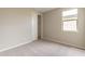 Cozy bedroom featuring neutral walls, carpet and closet at 24153 W Hilton Ave, Buckeye, AZ 85326