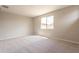 Empty bedroom, including carpet and window at 24153 W Hilton Ave, Buckeye, AZ 85326