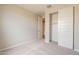 Neutral bedroom with carpet, closet and door at 24153 W Hilton Ave, Buckeye, AZ 85326