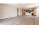 Open floor plan with hardwood floors, recessed lighting, and easy access to the kitchen area at 24153 W Hilton Ave, Buckeye, AZ 85326