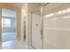 The main bathroom has a glass shower and storage shelves at 24153 W Hilton Ave, Buckeye, AZ 85326
