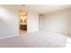 Spacious main bedroom features neutral carpet, paint, and an ensuite bathroom at 24153 W Hilton Ave, Buckeye, AZ 85326