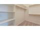 Bright walk-in closet features shelving and racks, offering optimal storage at 24153 W Hilton Ave, Buckeye, AZ 85326